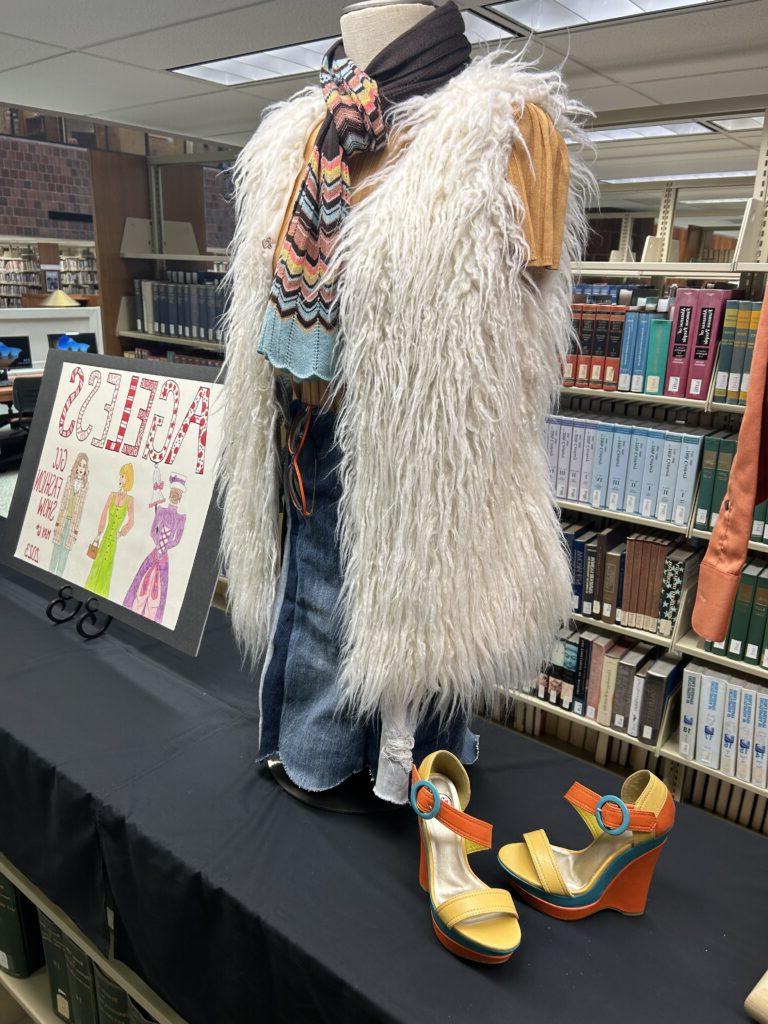 Fashion show library display with colorful sandal pumps and fuzzy vest/skirt /scarf outfit